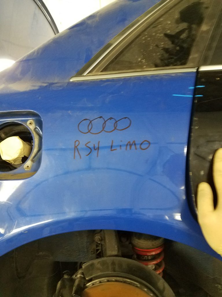 Nogaro blue Audi RS4 quarter panel freshly repainted in the Universe Auto Body paint booth