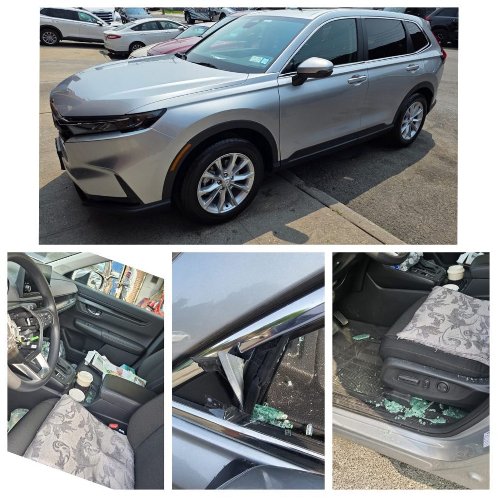 Silver Honda CR-V with shattered side window awaiting auto glass replacement in the Bronx